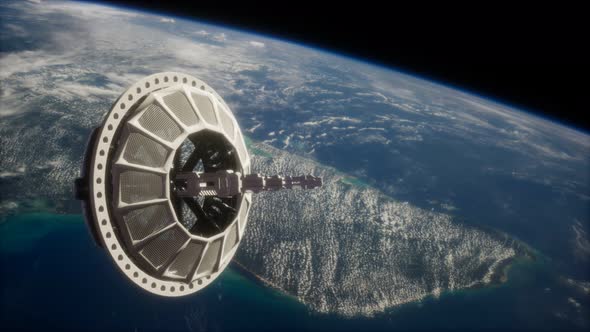 Futuristic Space Satellite Orbiting the Earth alt