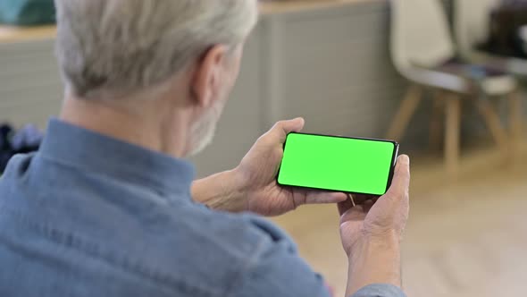 Old Man Watching Video on Chroma Key Smartphone