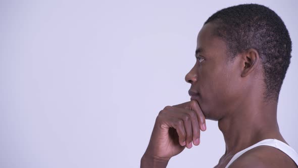 Closeup Profile View of Young Happy African Man Thinking