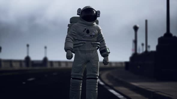 Astronaut Walks in the Middle of a Road