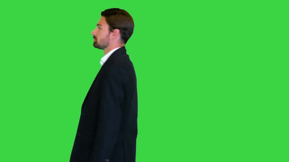 Handsome Business Man Walking By on a Green Screen Chroma Key
