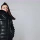 Caucasian brunette model in studio on wear jacket autumn warm close concept. Slow motion in wind - VideoHive Item for Sale