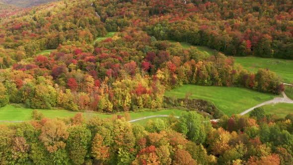 Golf Field at Killington Mountain Resort with Cinematic Fall Foliage Forest View