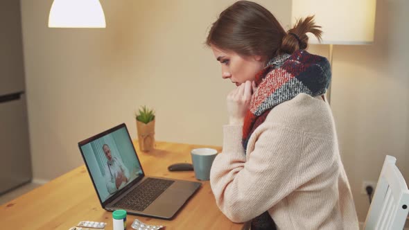 Woman in Selfisolation Communicates with a Doctor By Video Call Using a Laptop a Patient Consults a