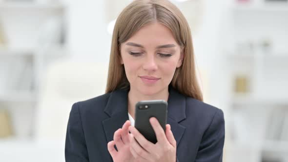 Portrait of Attractive Young Businesswoman Using Smartphone 