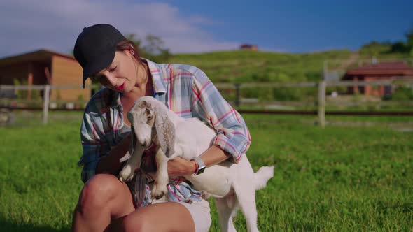 Woman Farmer Takes Care of Her Animals