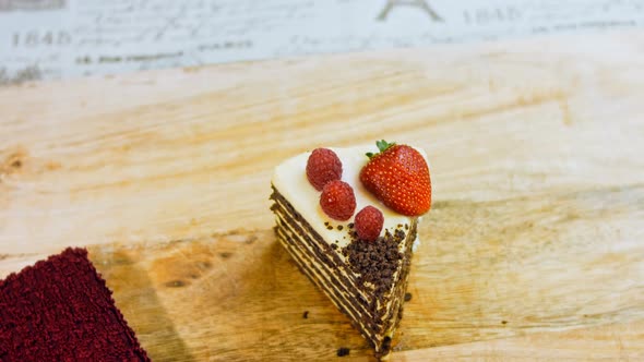 A Slice of Strawberry and Raspberry Cake and Slices Pressed with Chocolate