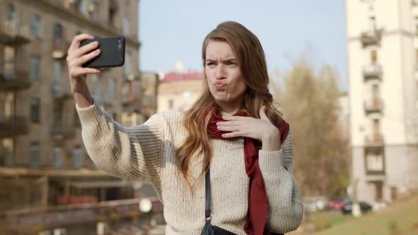 Hipster Girl Taking Selfie Outdoors, Flirting Woman Grimacing for Camera