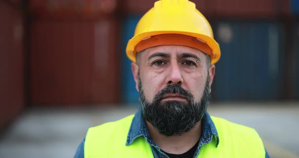 Man looking on camera working at freight terminal port