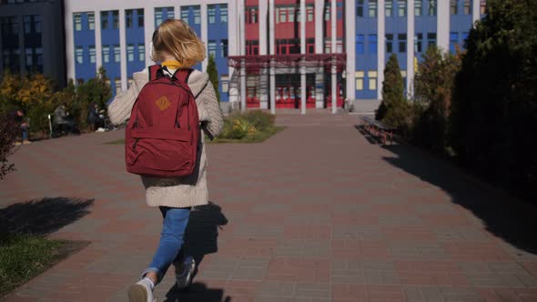 Cheerful Middle School Girl Running To Lessons