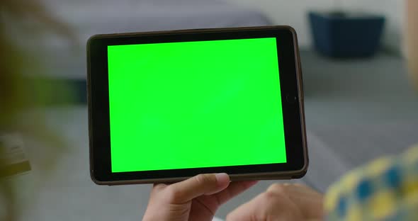 Man Uses a Tablet Computer with Chroma Key, Close Up