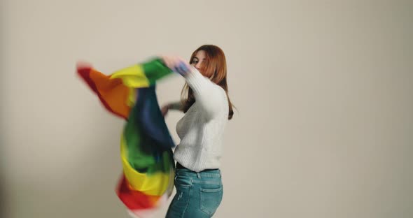 Girl Celebrates with Rainbow Peace Flag