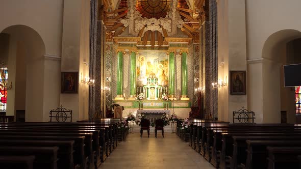 large catholic church with benches and an altar