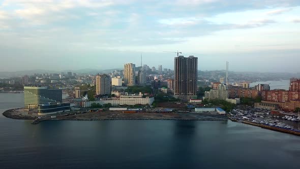 Drone View of the City and Marina Located on the Peninsula at Sunset