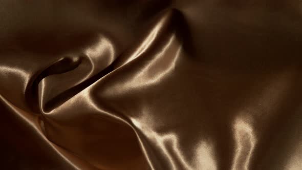 Golden Wavy Fabric Background in Super Slow Motion