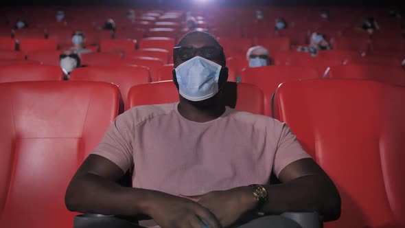 Portrait of Masked African American Man in Cinema