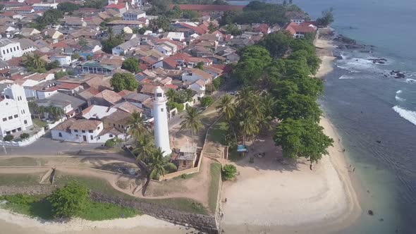 Lighthouse and Palm Trees Near Small Town at Galle Fort