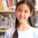 Asian teenager student reading a book in school library. - VideoHive Item for Sale
