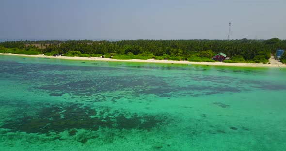 Beautiful birds eye island view of a summer white paradise sand beach and aqua turquoise water backg