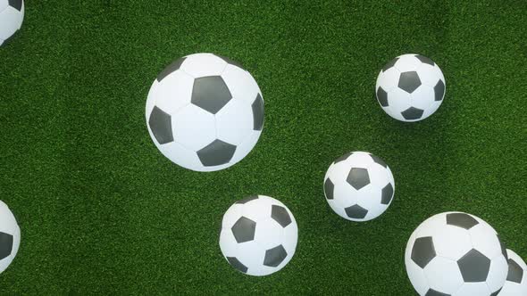 4K video animation. Soccer balls falling on grass field. Sports concept.