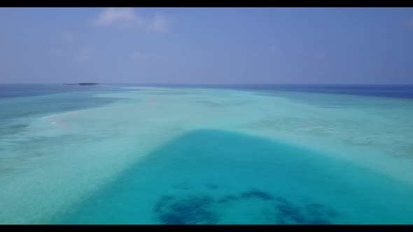 Aerial top view sky of tropical shore beach lifestyle by shallow sea with bright sandy background of