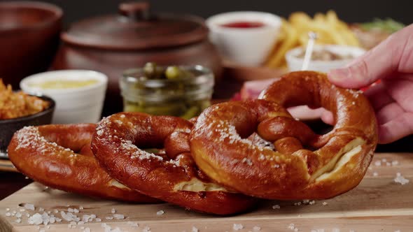 Putting Fresh Baked Pretzel Closeup