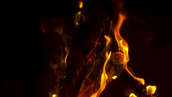 Beautiful slow motion footage of firewood burning in a hot fire