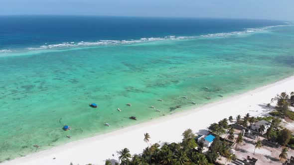 Ocean Coastline Barrier Reef By Beach Hotels at Low Tide Zanzibar Aerial View