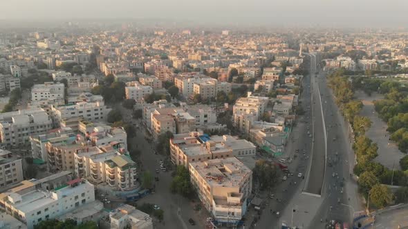 Aerial Over Apartment Buildings In Karachi During Sunset. Follow Shot, Slow Motion