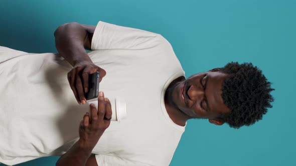 Portrait of Modern Person Looking at Display on Smartphone