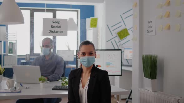 Portrait of Woman Manager Wearing Face Mask to Prevent Infection with Coronavirus