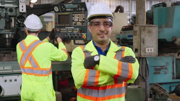 Young Factory Worker or Engineer Close Up Portrait in Factory