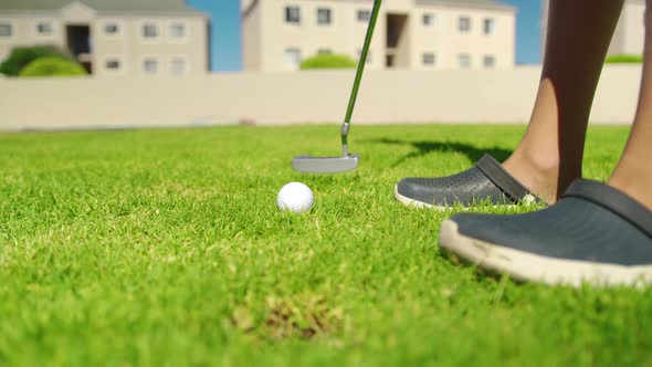 Close Up of the Golf Stick Hitting a Golf Ball