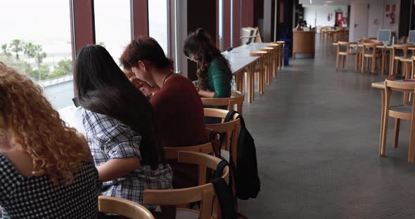 Young students studying inside university library