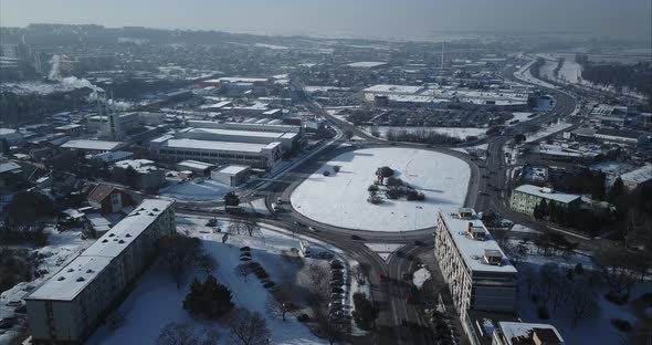 Flying towards big roundabout in Nitra City, Winter, Aerial shot, Slovakia