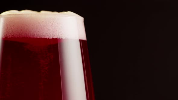 Foamy Cherry Beer in Glass Closeup Belgian Lambic