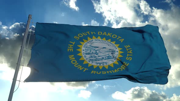 Flag of South Dakota Waving in the Wind Against Deep Beautiful Clouds Sky