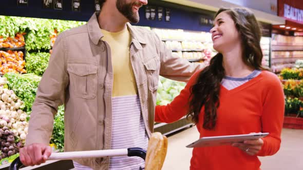 Couple embracing each other in organic section