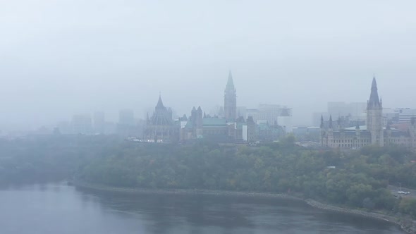Aerial view of Canadian parliament through thick fog
