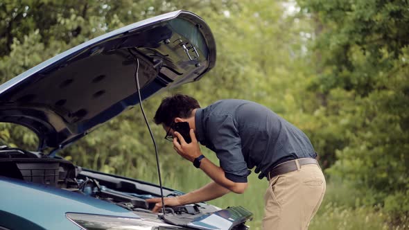 Popped Up Hood Man Fix Car Problem. Pop Up Car Hood To Repair Damaged Auto Repair Service.