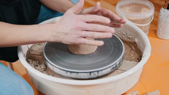 A Man Potter Slowly Forming the Clay