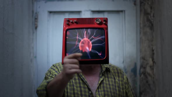 Man with an Old TV Instead of Head, showing a Plasma Ball on Screen.