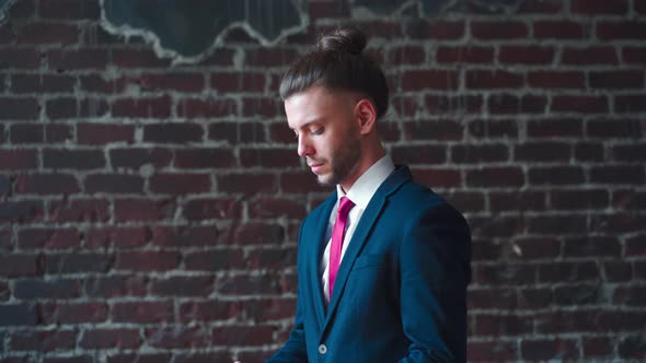 Handsome Business Man Dressed Business Suit Headphones Dancing Indoor Red Brick Wall Background