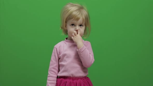 Happy Three Years Old Girl Picks Her Nose