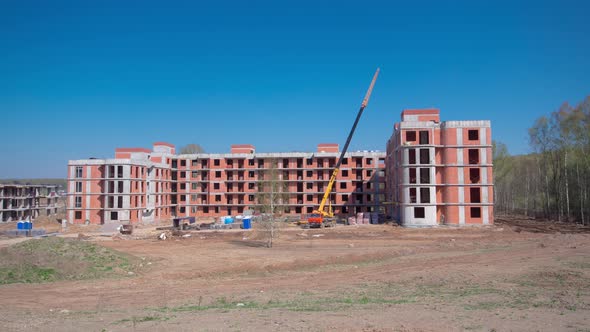 Large Construction Site with Buildings Under Construction and Multistorey Residential Homes