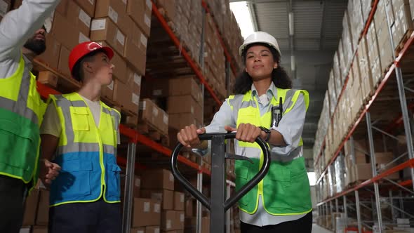 Joyful Storehouse Worker Riding Hand Pallet Truck