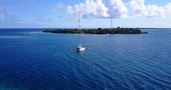 Beautiful birds eye tourism shot of a summer white paradise sand beach and blue ocean background in 