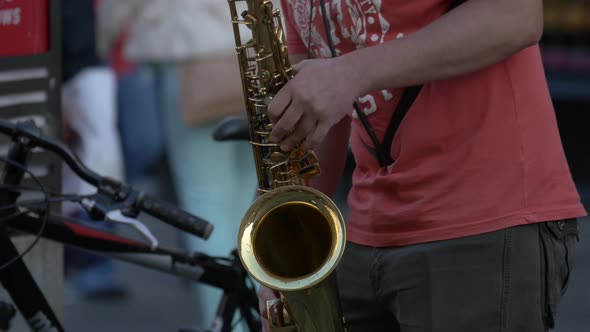 Playing the saxophone on the street