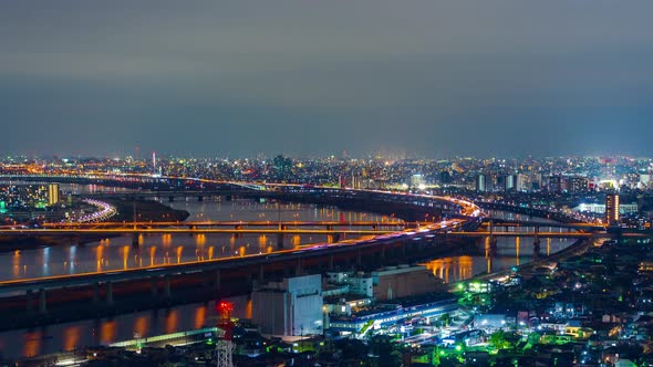 time lapse of cityscape and highway road bridge in Tokyo at night, Japan