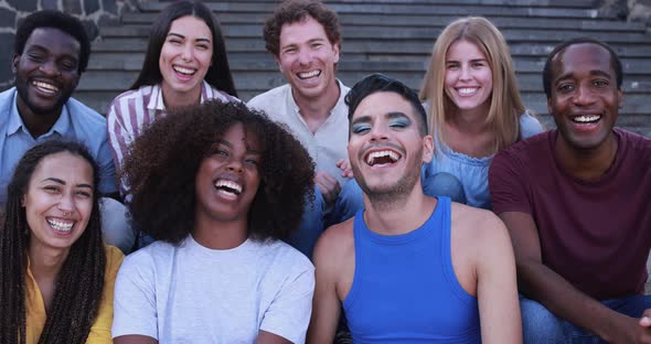 Young diverse people having fun outdoor laughing together - Diversity concept